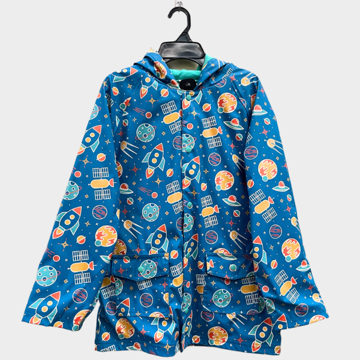 Kids lined rain jacket with buttons in space print.