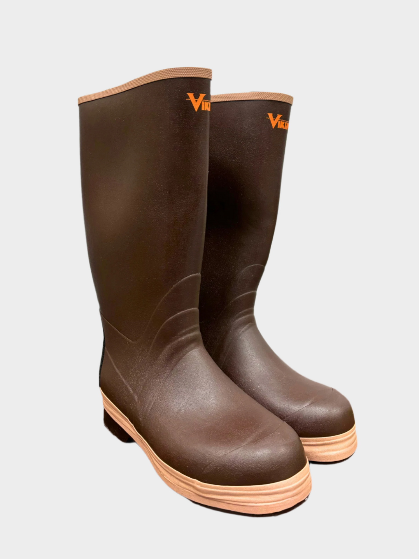 Brown rain boots and tan seam on top and sole. Small bright orange Viking logo an inch below top edge. Chevron sole with slight heel. Insulated inside.