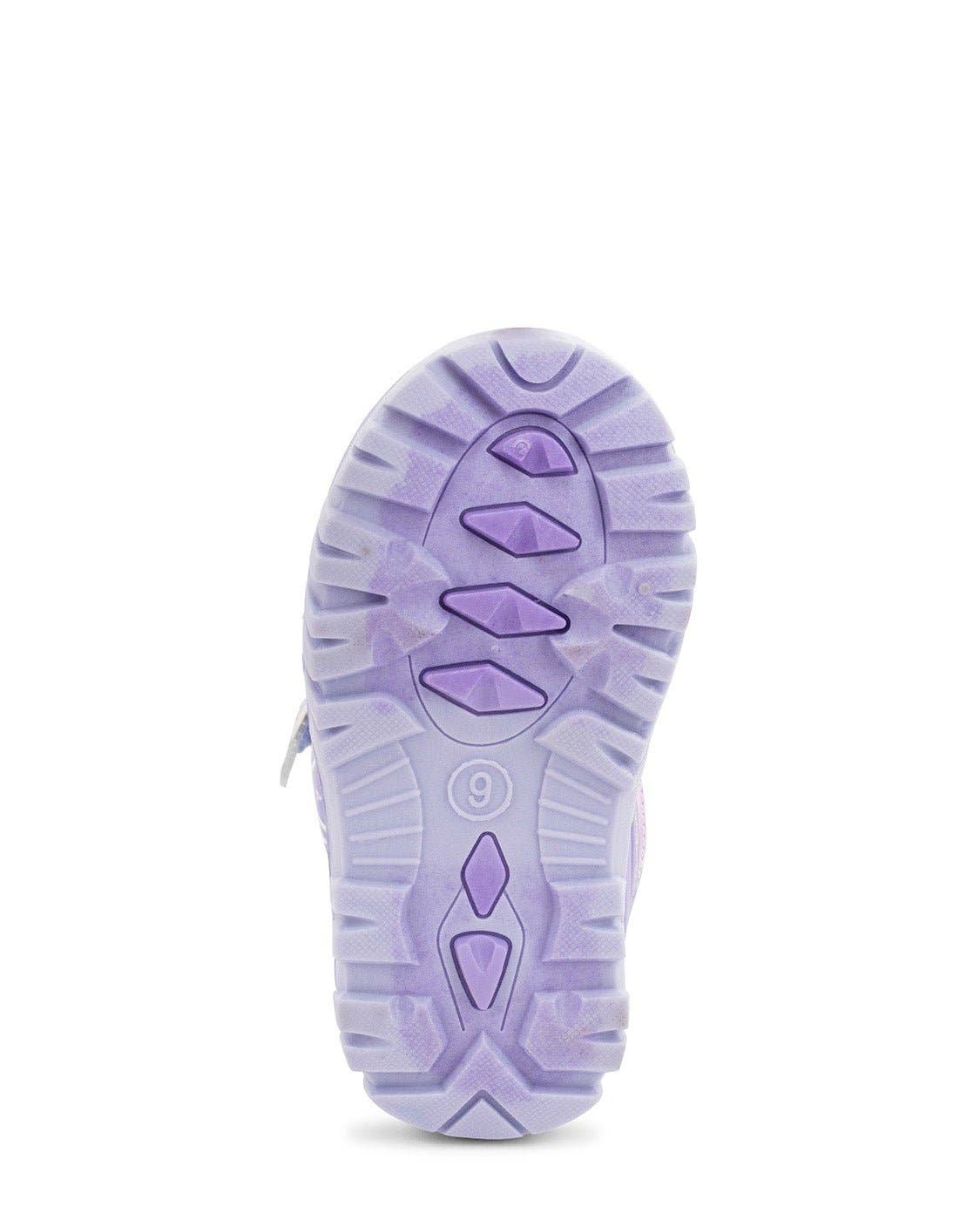 Purple sole of a shoe on a white background