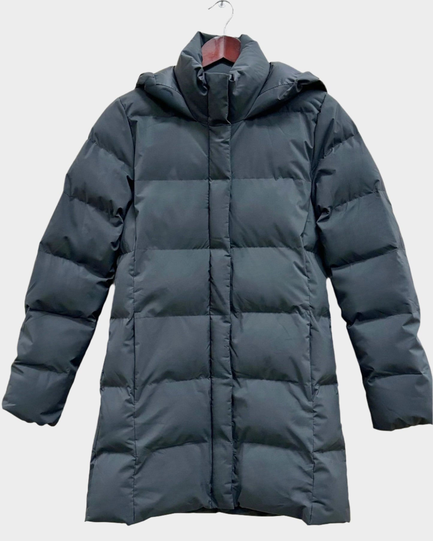Womens winter parka. Front is quilted with puffs insulation, also hand pockets. Sleeves and back are also quilted. Neck has a puffy chin warmer connected to the zipper. Hood is also quilted.