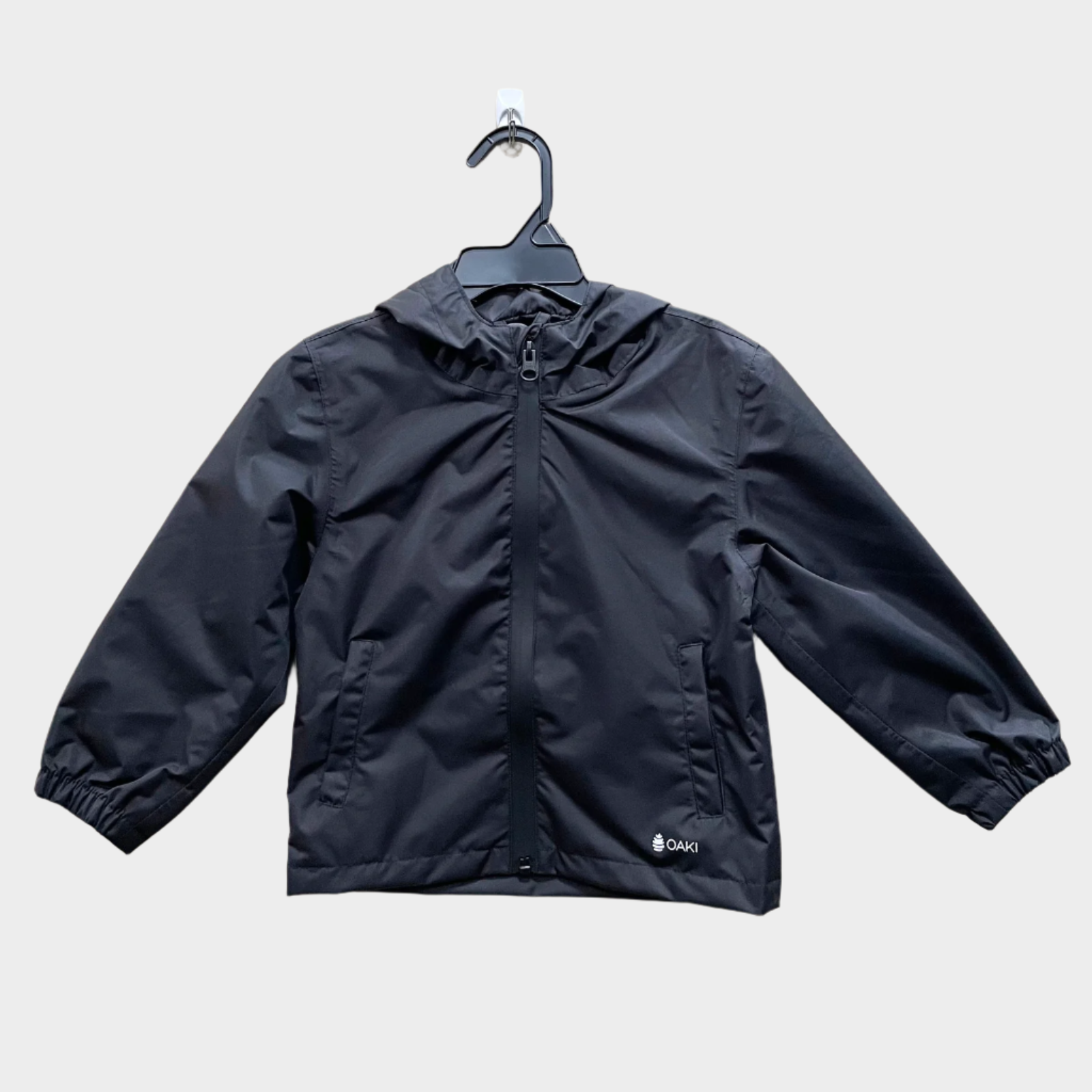 Kids rain shell with hood and a front pocket each side. Shown in orange