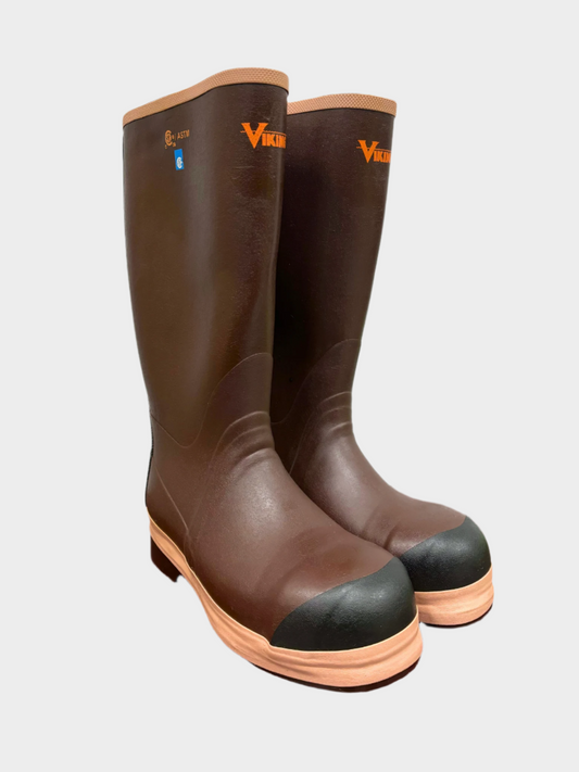 Tall rain boot hits below the knee. Main color is brown with tan trim on soles and top hem. Bright orange smal Viking logo on top front middle of boot. Black toe tip indicating steel toe