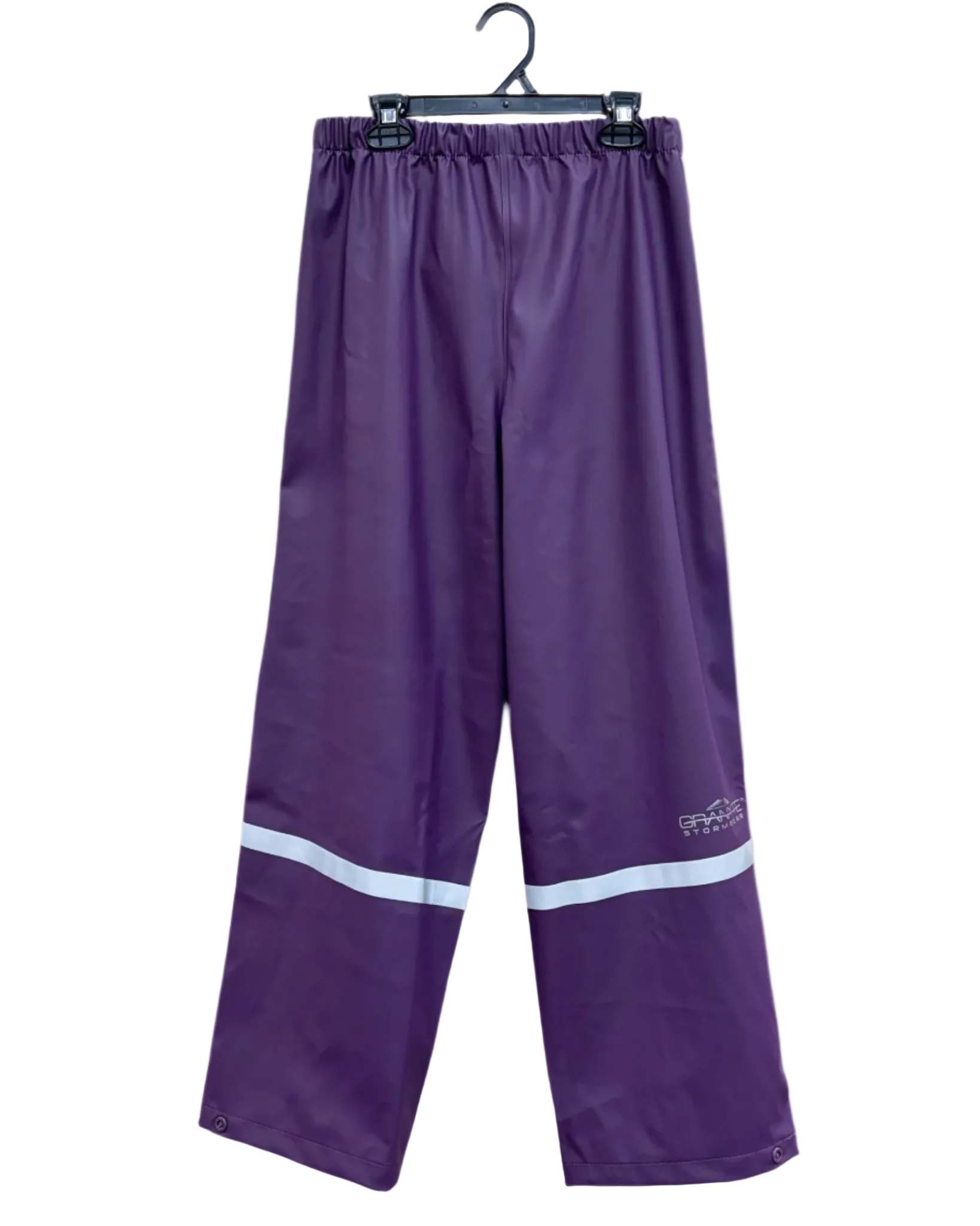 kids purple PU rain pants with reflective strip across lower legs. Button on ankle seams. Elastic waist.