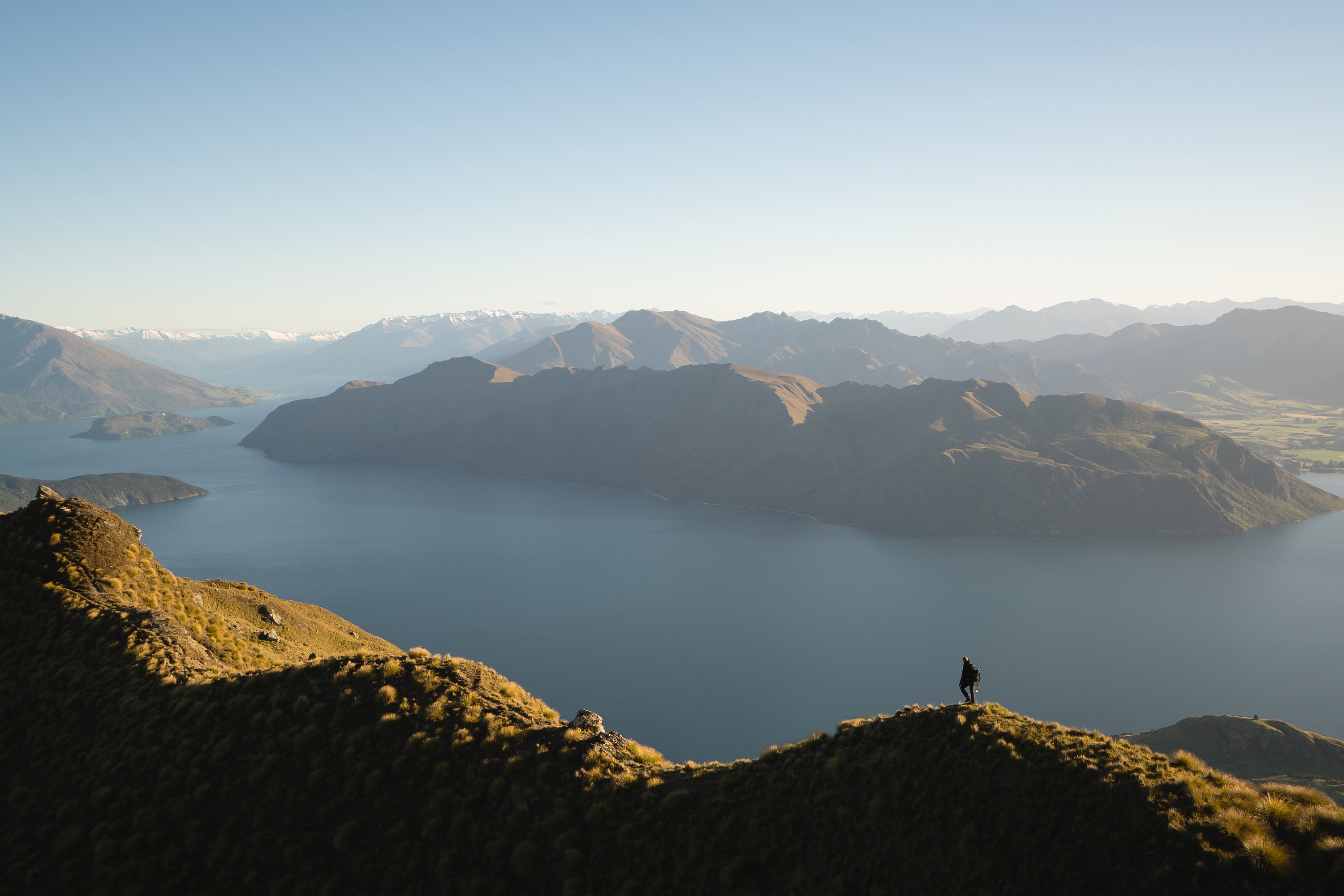 Stock image of tree covered mountains and water 