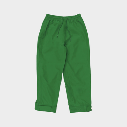 A pair of kids rain pants with an elastic waistband and drawstring. Ankles have a neoprene covered velcro adjustment. Shown in forest green