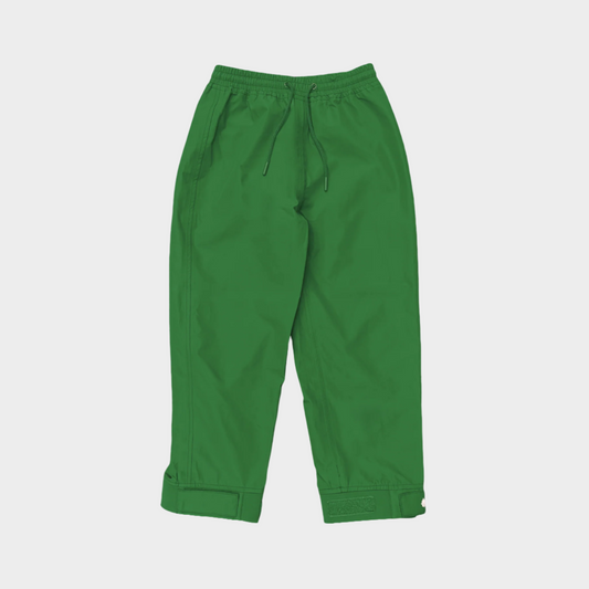 A pair of kids rain pants with an elastic waistband and drawstring. Ankles have a neoprene covered velcro adjustment. Shown in forest green
