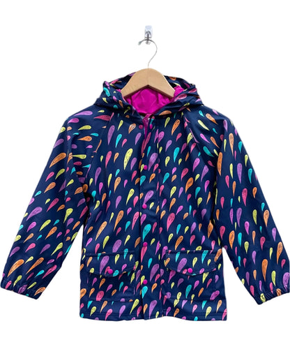 Kids lined rain coat, attached hood, and pockets. Shown in colorful rain drops and dark purple background on coat.