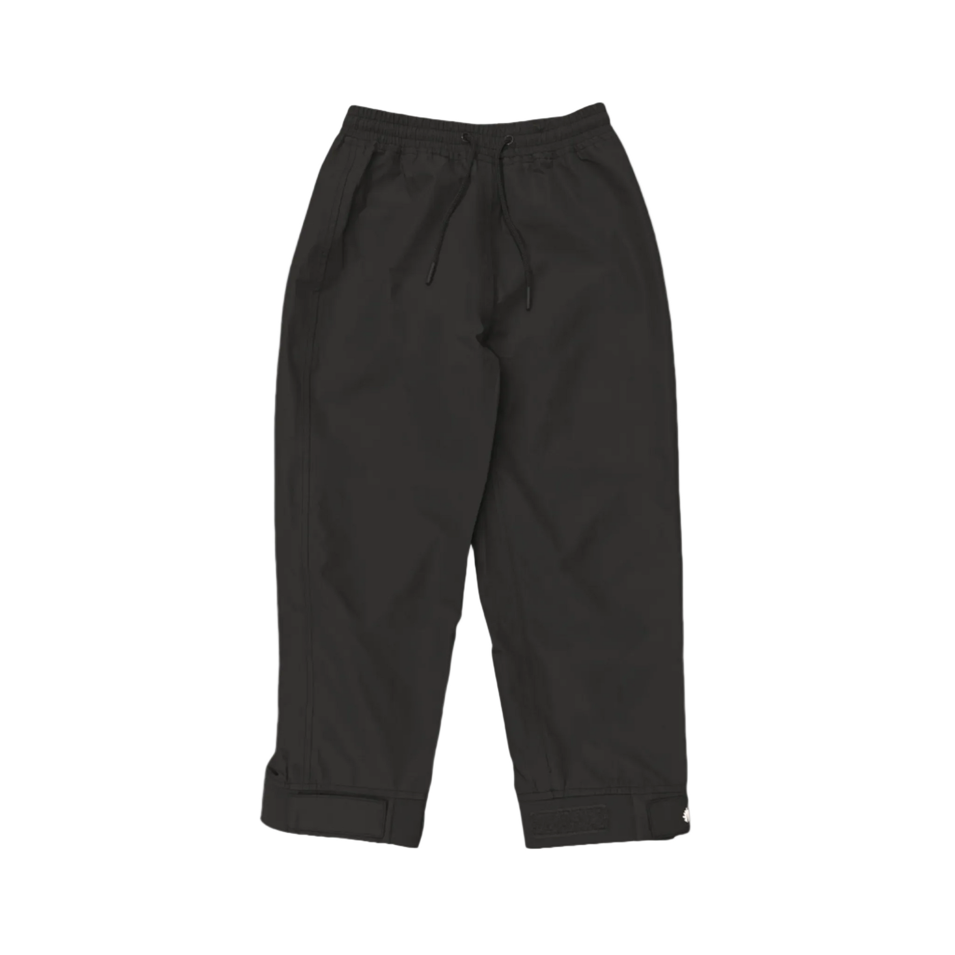 A pair of kids rain pants with an elastic waistband and drawstring. Ankles have a neoprene covered velcro adjustment. Shown in black