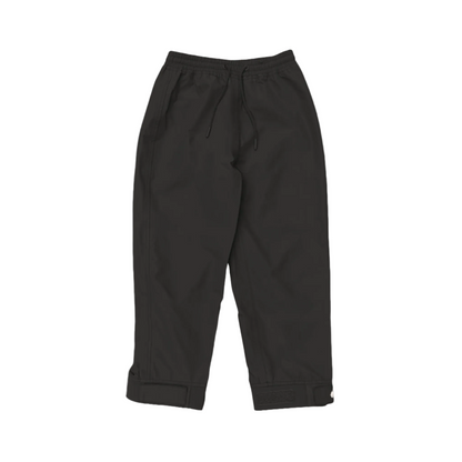 A pair of kids rain pants with an elastic waistband and drawstring. Ankles have a neoprene covered velcro adjustment. Shown in black