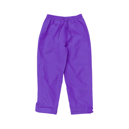 A pair of kids rain pants with an elastic waistband and drawstring. Ankles have a neoprene covered velcro adjustment. Shown in solid purple