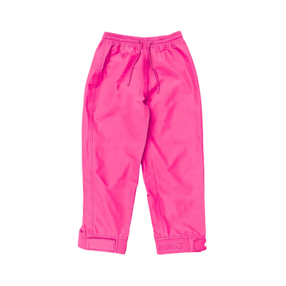 A pair of kids rain pants with an elastic waistband and drawstring. Ankles have a neoprene covered velcro adjustment. Shown in bright pink