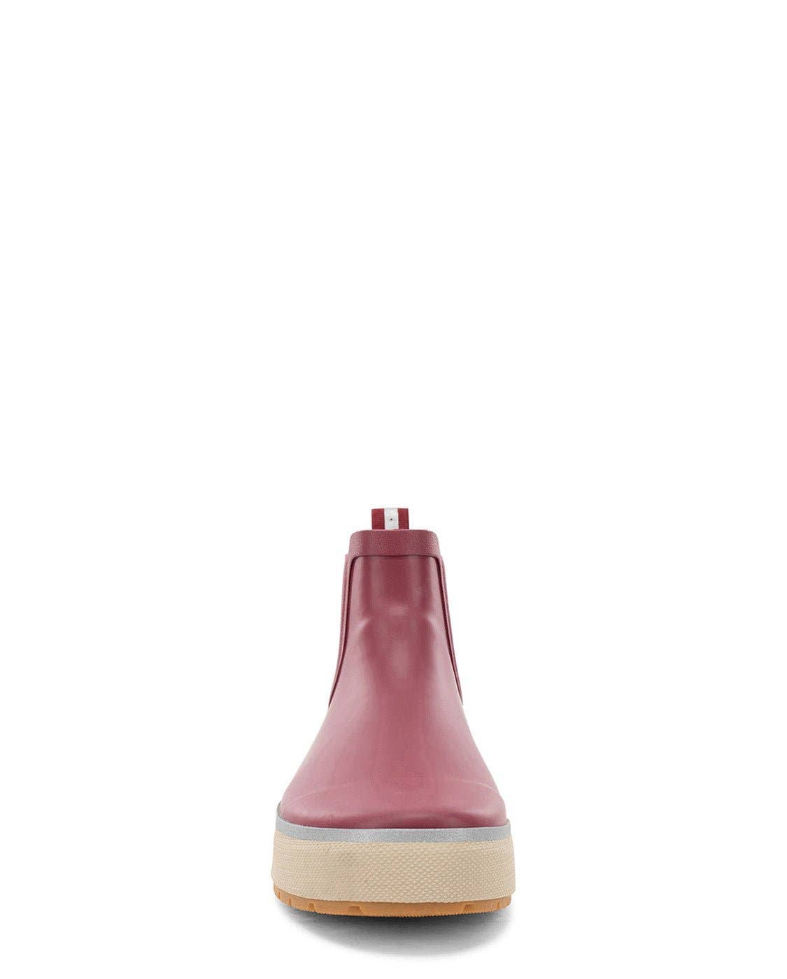Pink rubber boot with a beige sole on a white background