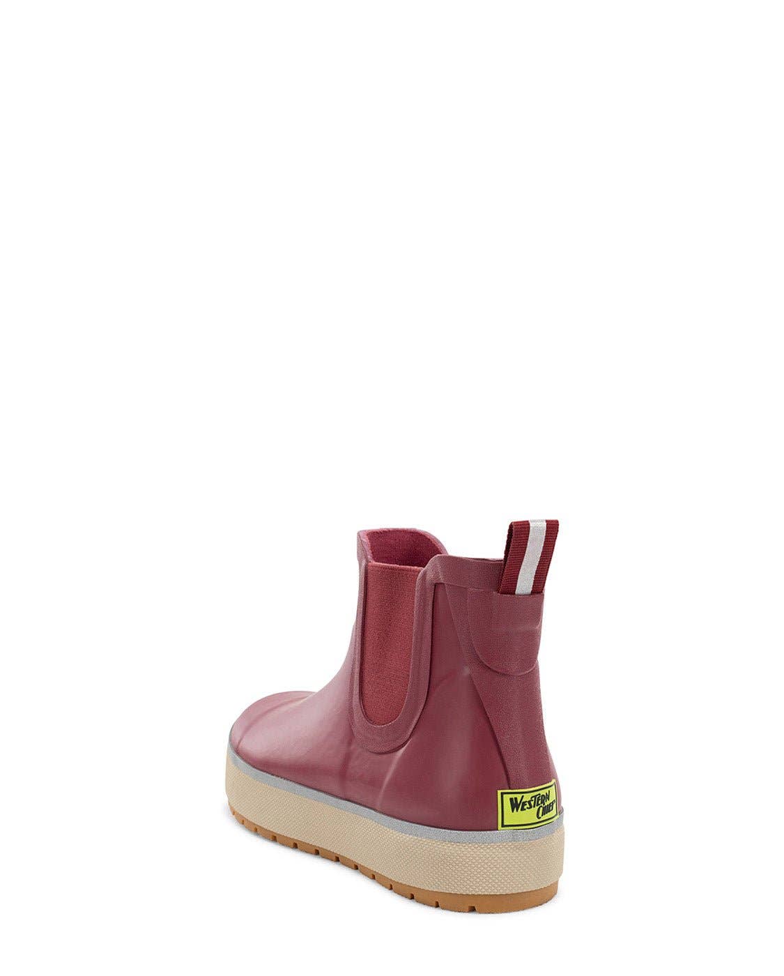 Pink rain boot with a visible brand label on a white background
