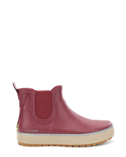 Pink rubber boot with a beige sole on a white background