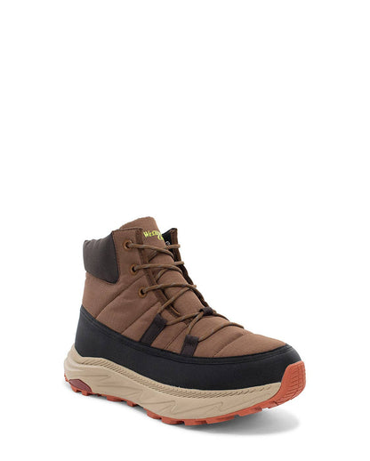 Brown and black boot with orange sole on a white background