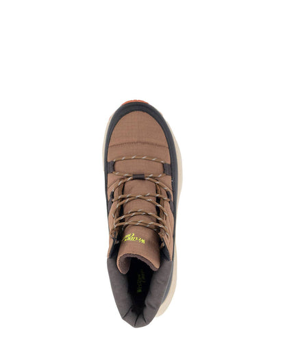 Brown hiking boot with black sole on a white background