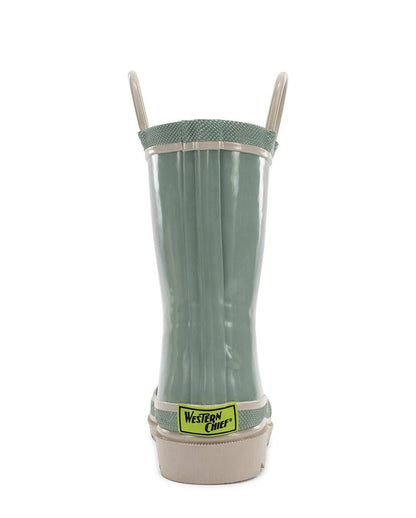Green rain boot with a beige sole on a white background